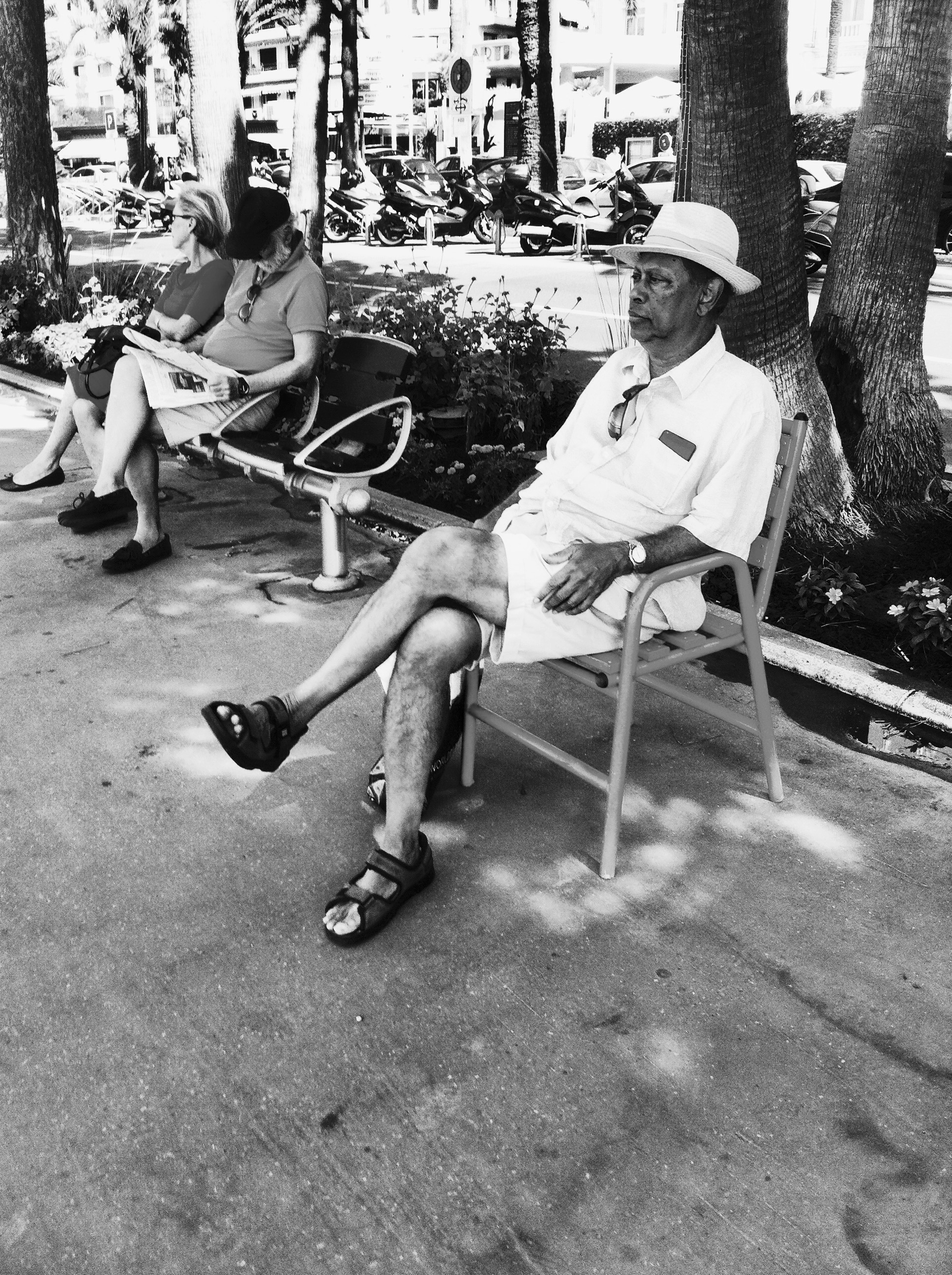 a man sitting on a chair on La Croisette in Cannes - Paul Conneally 2016